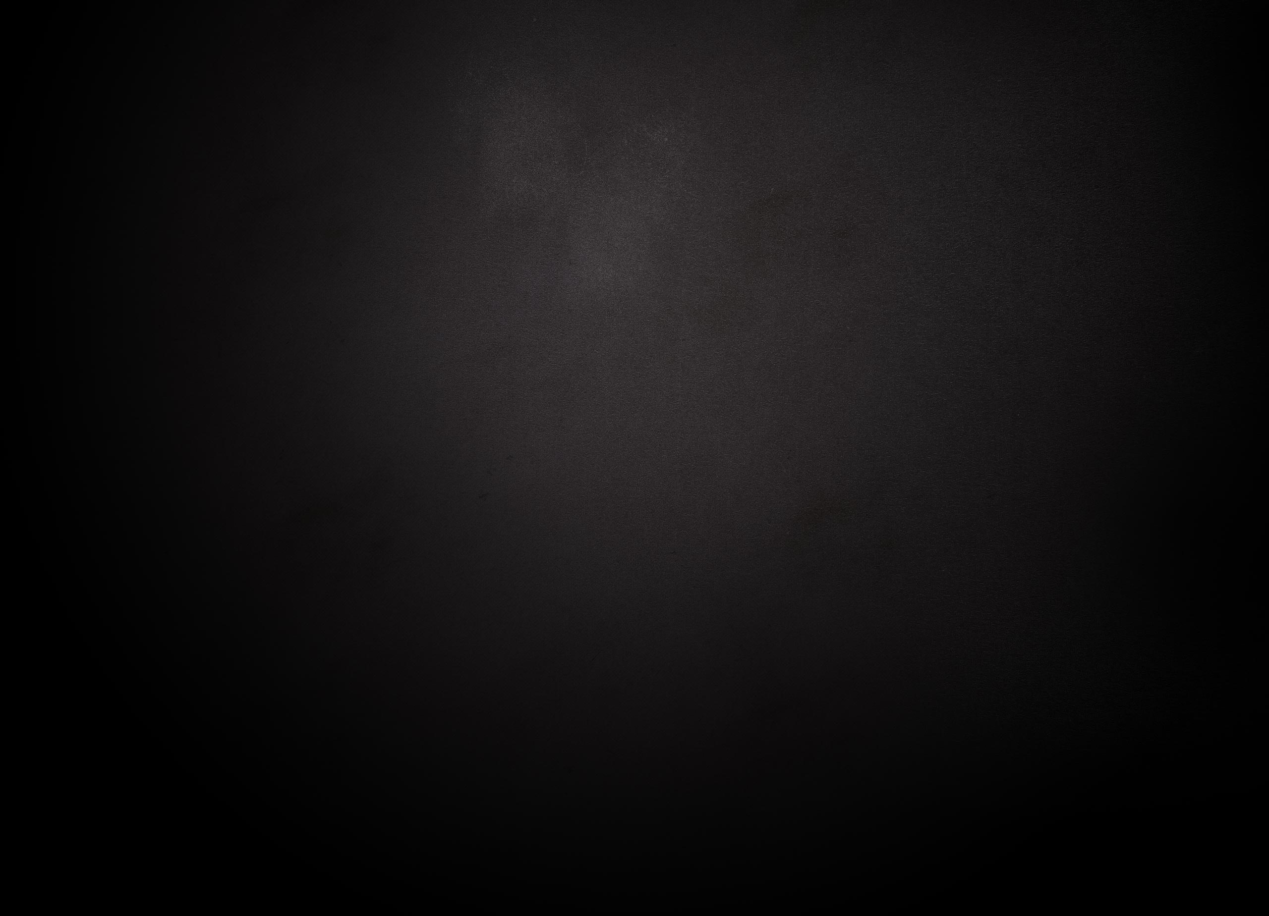 Dark textured background fading from black to subtle gray, moody and minimal